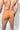 Person wearing tan boxer briefs against a plain background