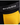 Close-up of Erobold Pocket Brief in Black & Yellow showing the front pocket panel detail